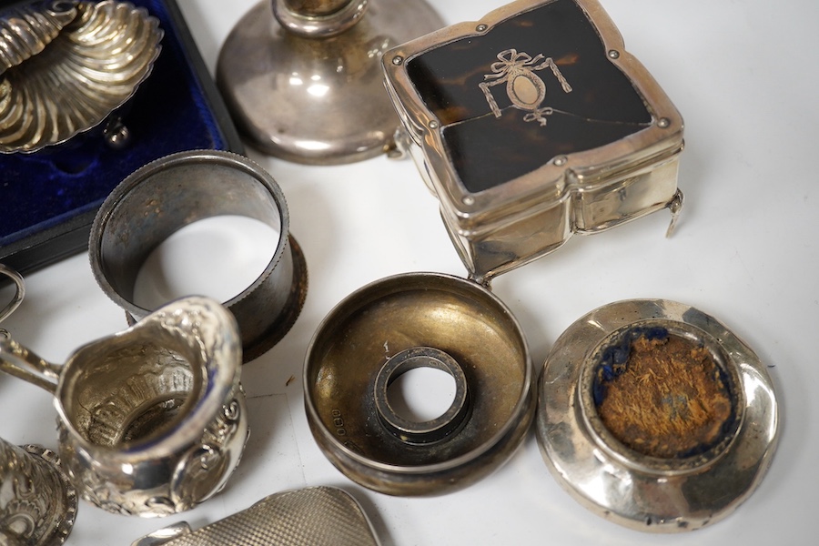 A collection of mainly small silver items including a George V posy vase, mother of pearl handled fruit knife, sovereign case, cream jug, tortoiseshell and silver trinket box (a.f.), continental miniature white metal tan